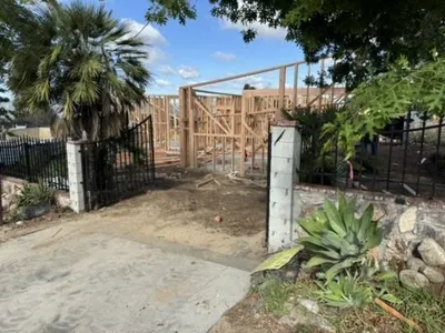 Altadena new home construction behind gated entrance featuring 1325-gallon underground fire tank