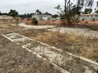 Pre-construction view of the Altadena W Mendocino Ave fire rebuild lot showing cleared site conditions