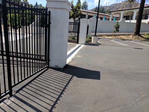 Chevy Chase Country Club entrance gate with our grading plan managing site drainage